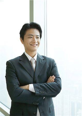 simsearch:693-03311509,k - Businessman standing with arms folded, smiling Stock Photo - Premium Royalty-Free, Code: 695-05764902
