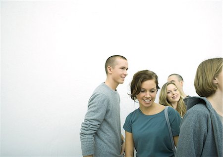 Group of young adult and teenage friends, white background Stock Photo - Premium Royalty-Free, Code: 695-05765114