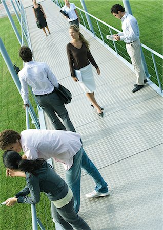 simsearch:695-05764382,k - Group of people involved in different activities on walkway Stock Photo - Premium Royalty-Free, Code: 695-05765230