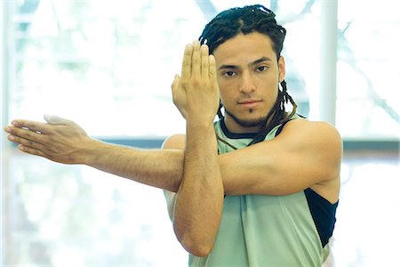 dreadlocks closeup - Man doing arm stretches Stock Photo - Premium Royalty-Free, Code: 695-05765259