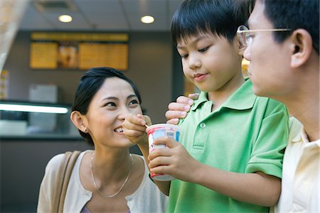 simsearch:696-03401226,k - Boy eating sweet snack, parents watching Stock Photo - Premium Royalty-Free, Code: 695-05765250