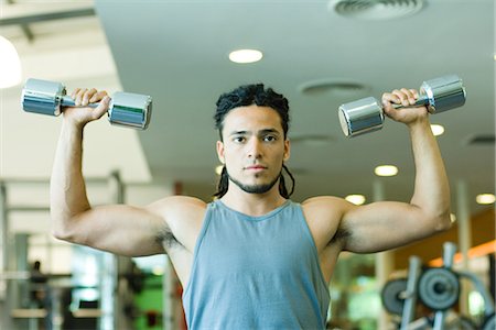 simsearch:695-03375202,k - Man lifting dumbbells, waist up, front view Stock Photo - Premium Royalty-Free, Code: 695-05765360