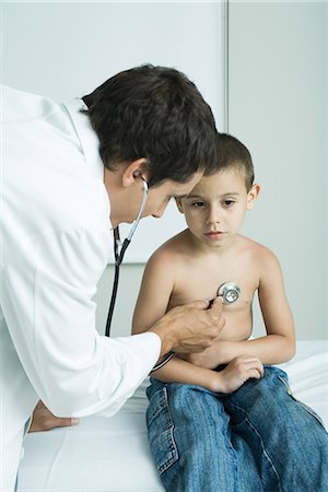 paediatrician (male) - Doctor listening to boy's chest with stethoscope Stock Photo - Premium Royalty-Free, Code: 695-05765424
