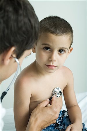 paediatrician (male) - Doctor listening to boy's chest with stethoscope Stock Photo - Premium Royalty-Free, Code: 695-05765425