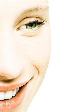 simsearch:695-03375605,k - Teenage girl's face, smiling, extreme close-up Foto de stock - Royalty Free Premium, Número: 695-05765692