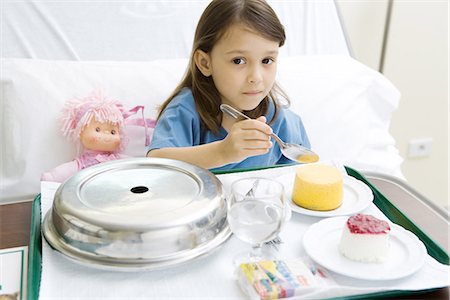 patient food - Girl eating meal in hospital bed Stock Photo - Premium Royalty-Free, Code: 695-05765960