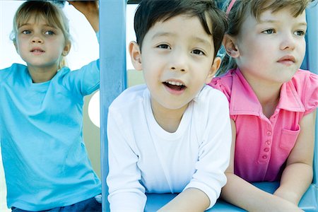 pink and blue boy and girl - Children on playground equipment Stock Photo - Premium Royalty-Free, Code: 695-05766029