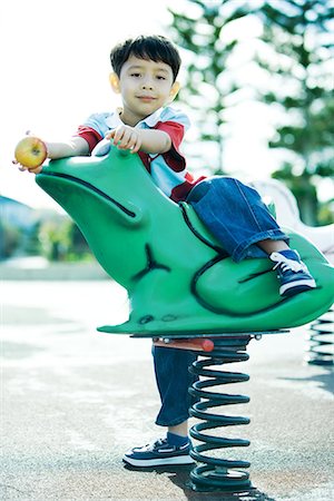 Child on playground equipment Stock Photo - Premium Royalty-Free, Code: 695-05766023