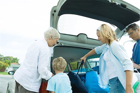 Family unloading trunk of car Stock Photo - Premium Royalty-Free, Code: 695-05766037