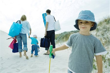 family and luggage summer - Family walking through dunes to beach Stock Photo - Premium Royalty-Free, Code: 695-05766052