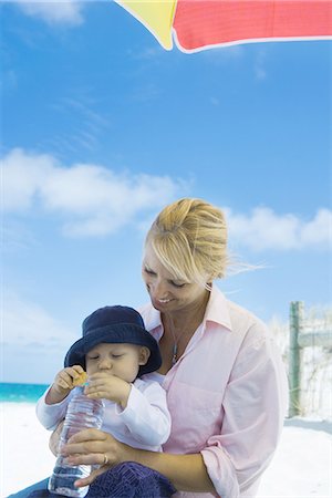 Baby with mother on beach Stock Photo - Premium Royalty-Free, Code: 695-05766138