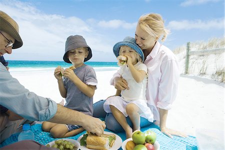 family eating on the beach - Family having picnic on beach Stock Photo - Premium Royalty-Free, Code: 695-05766132