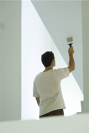 simsearch:400-04053662,k - Man painting wall with paintbrush Stock Photo - Premium Royalty-Free, Code: 695-05766303