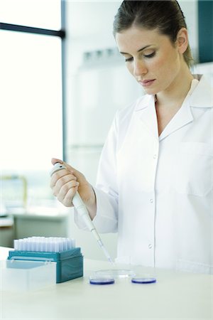 eye dropper and pipette woman - Female lab worker dropping solution into Petri dish Stock Photo - Premium Royalty-Free, Code: 695-05766486