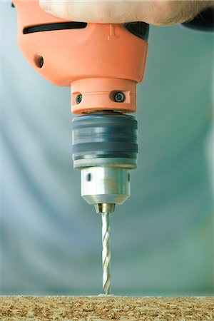 Man using drill, close-up Stock Photo - Premium Royalty-Free, Code: 695-05766795