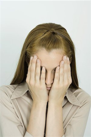 Young woman, hands over face, portrait Fotografie stock - Premium Royalty-Free, Codice: 695-05766863