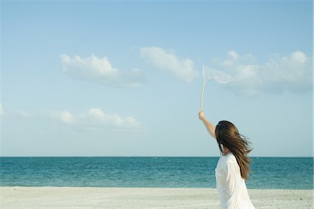 Woman catching clouds with butterfly net Foto de stock - Sin royalties Premium, Código: 695-05767198
