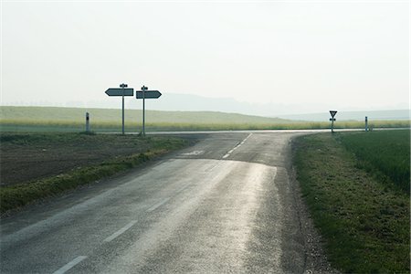 fork in road - Forked road in countryside Stock Photo - Premium Royalty-Free, Code: 695-05767605