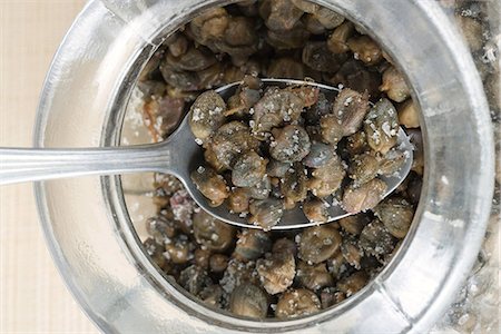 simsearch:695-05770947,k - Spoonful of capers and salt over jar, close-up Stock Photo - Premium Royalty-Free, Code: 695-05767751