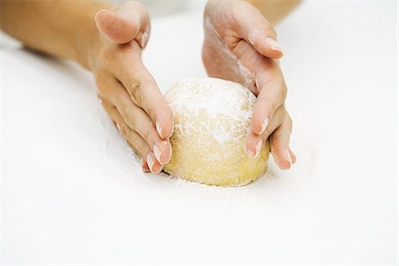 Woman kneading dough, cropped view of hands Stock Photo - Premium Royalty-Free, Code: 695-05767773