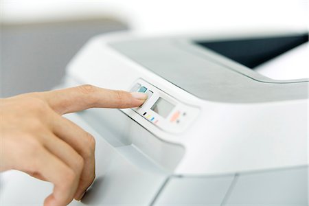 printer paper - Hand pushing button on printer, close-up Foto de stock - Sin royalties Premium, Código: 695-05768441