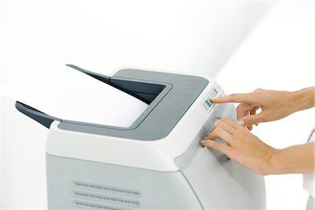 photocopie - Hands pushing button on printer, cropped view Foto de stock - Sin royalties Premium, Código: 695-05768676