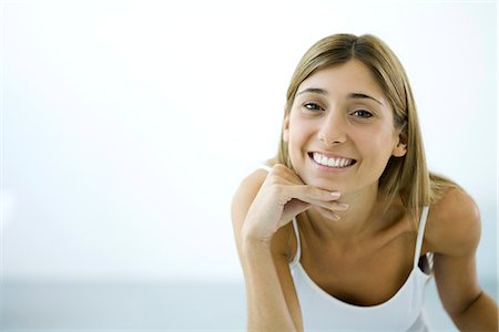 simsearch:695-05766280,k - Woman smiling at camera, portrait Stock Photo - Premium Royalty-Free, Code: 695-05768737