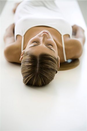 Woman lying on back, rear view Stock Photo - Premium Royalty-Free, Code: 695-05768747