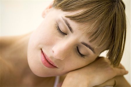 portrait of beautiful young woman with closed eyes - Woman resting head on shoulder, eyes closed Stock Photo - Premium Royalty-Free, Code: 695-05768751