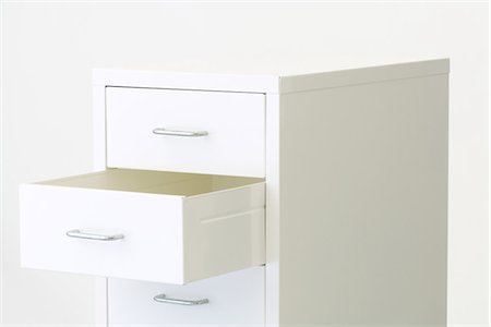 fichero - Chest of drawers, one drawer open Foto de stock - Sin royalties Premium, Código: 695-05768949