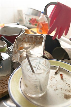 dirty kitchen images - Kitchen sink piled over with dirty dishes Stock Photo - Premium Royalty-Free, Code: 695-05769408