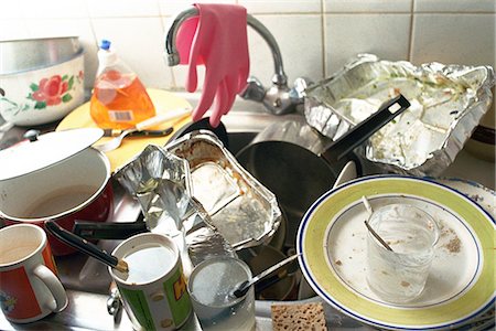 simsearch:693-06403379,k - Kitchen sink, counter piled over with dirty dishes Stock Photo - Premium Royalty-Free, Code: 695-05769409