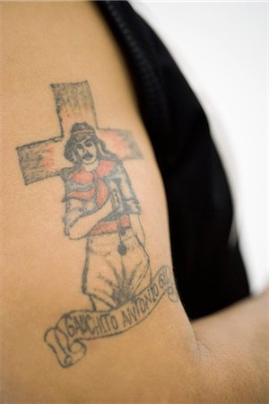 Tattoo of Gauchito Antonio Gil (Little Gaucho Gil) on man's bicep Stock Photo - Premium Royalty-Free, Code: 695-05769486