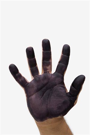Man's hand with black paint on palm Stock Photo - Premium Royalty-Free, Code: 695-05769495