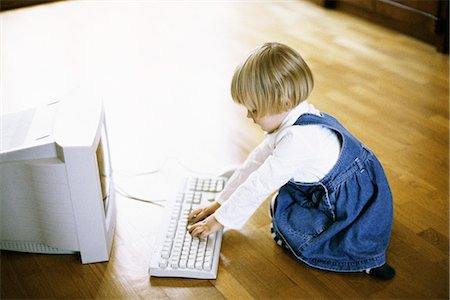 picture of a keyboard computer kids - Little girl using computer Stock Photo - Premium Royalty-Free, Code: 695-05769797