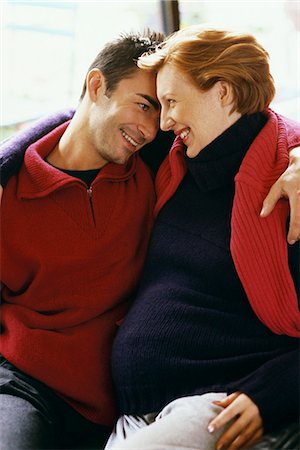 Expecting couple embracing, smiling Stock Photo - Premium Royalty-Free, Code: 695-05769792