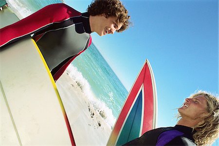 simsearch:695-03373539,k - Surfers on beach having conversation Stock Photo - Premium Royalty-Free, Code: 695-05769835