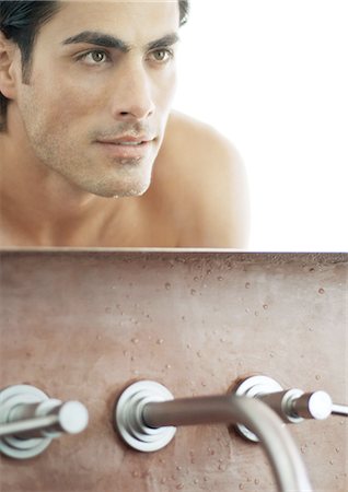 simsearch:632-01154783,k - Man's face in bathroom mirror Stock Photo - Premium Royalty-Free, Code: 695-05762384