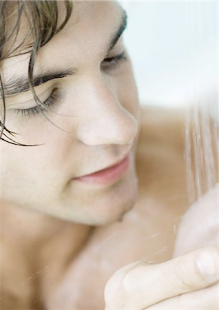 Man in shower, close-up Stock Photo - Premium Royalty-Free, Code: 695-05762396