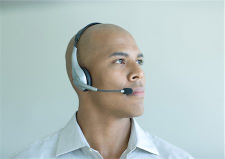 Man wearing headset, portrait Stock Photo - Premium Royalty-Free, Code: 695-05762804