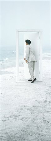 door of opportunity - On beach, businessman opening door Stock Photo - Premium Royalty-Free, Code: 695-05762897