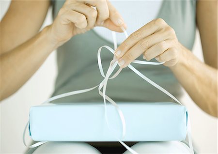 Woman wrapping present Stock Photo - Premium Royalty-Free, Code: 695-05763180