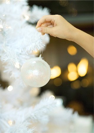 simsearch:600-03644659,k - Child hanging christmas ornament on tree Stock Photo - Premium Royalty-Free, Code: 695-05763197