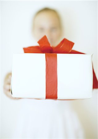 simsearch:649-06812641,k - Holding out gift Stock Photo - Premium Royalty-Free, Code: 695-05763208