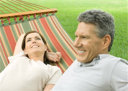 Mature couple lounging in hammock Stock Photo - Premium Royalty-Free, Code: 695-05763256