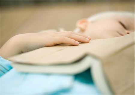 photography of little girl dreaming - Girl sleeping with book on chest Stock Photo - Premium Royalty-Free, Code: 695-05763599