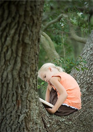 reader - Girl in tree reading Stock Photo - Premium Royalty-Free, Code: 695-05763604