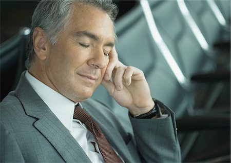 simsearch:695-03388701,k - Businessman sleeping in airport lounge Stock Photo - Premium Royalty-Free, Code: 695-05763948
