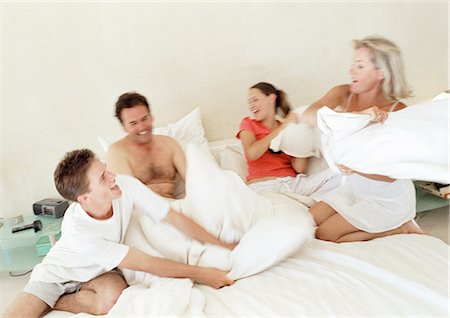 Family having pillow fight, blurred motion Stock Photo - Premium Royalty-Free, Code: 695-05774020