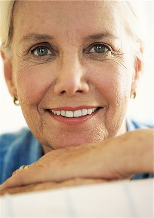 Mature woman smiling, close-up, portrait Stock Photo - Premium Royalty-Free, Code: 695-05774308